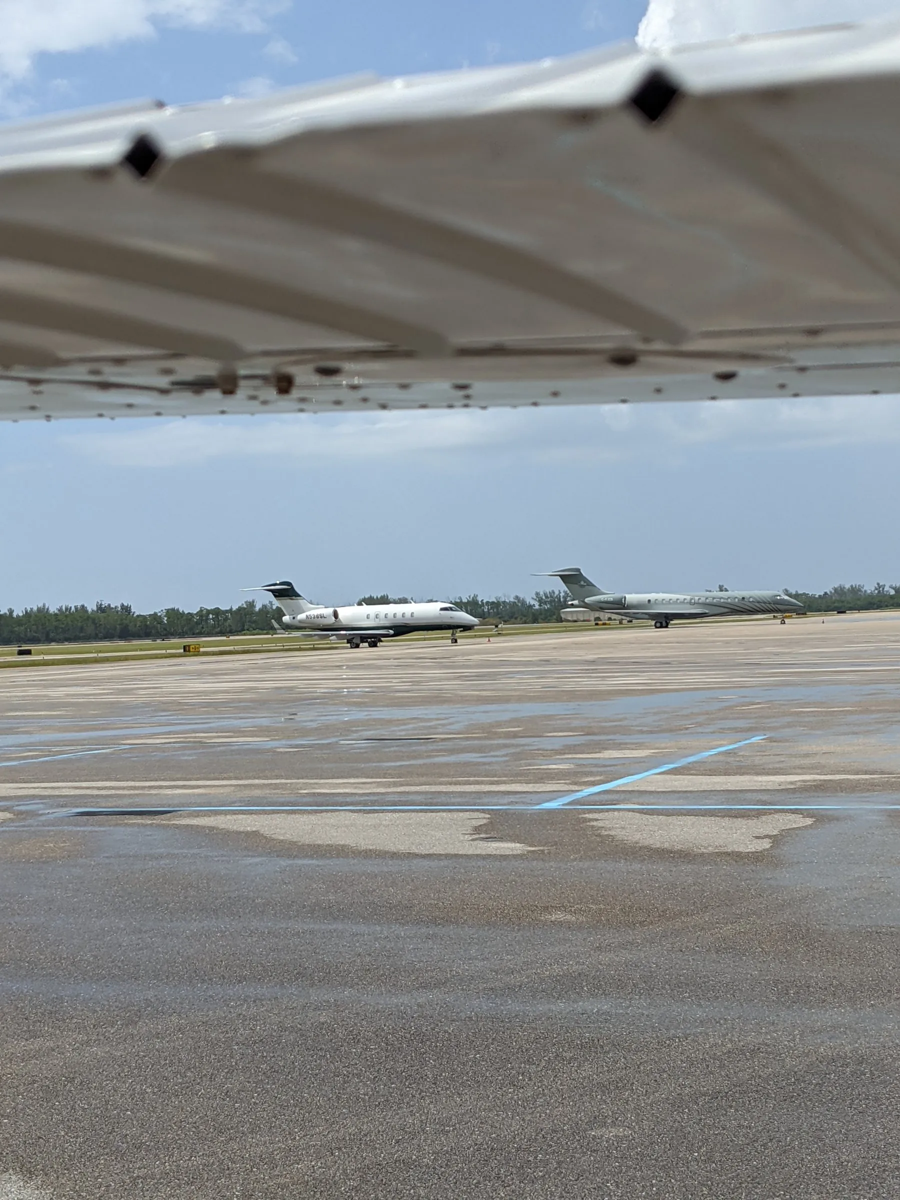 Under the wing, jets on the ramp